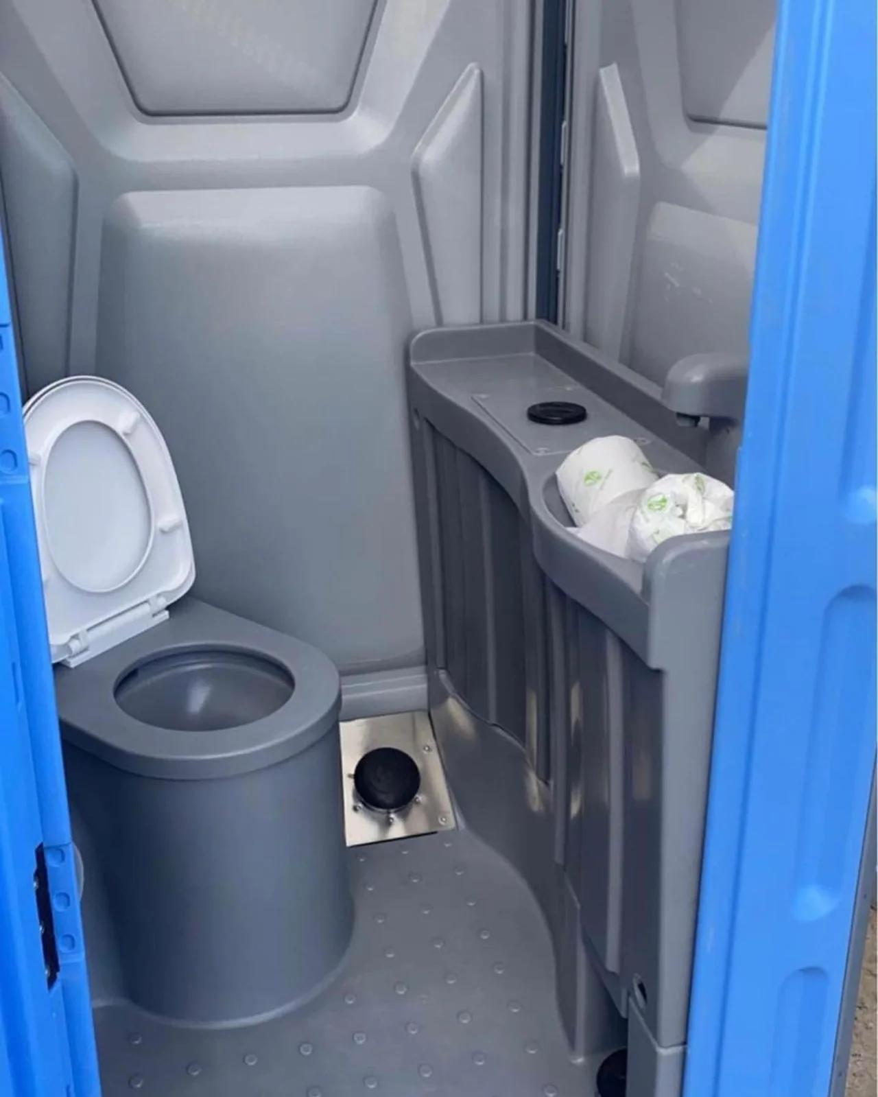Portable toilet with an internal sink